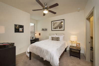 Apartment bedroom with bed and desk