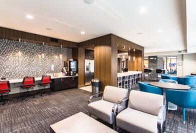 Interior lounge with seating and coffee machine