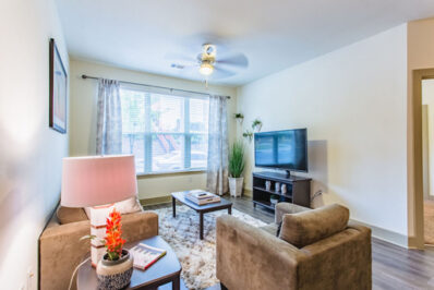 Apartment living area with seating area and TV