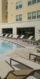 Resort style pool surrounded by lounge chairs