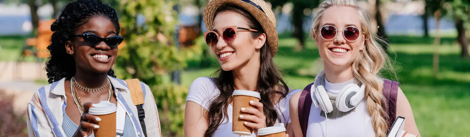 Women smiling wearing sunglasses